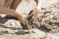 Child hands are digging in the sand Royalty Free Stock Photo