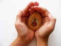 Children hands with orthodox icon