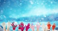 Children hands with winter gloves and snowballs, christmas background