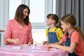 Children happily looked at mom playing board games