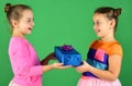 Children with happy faces pose with presents on green background Royalty Free Stock Photo