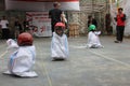 children with happy faces take part in a traditional competition to commemorate Indonesia's independence day