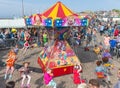 Children have fun in a carousel at a Dutch national holiday