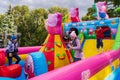 Children have fun on an inflatable slide at a city holiday. For editorial use. October 2, 2022 Balti Moldova