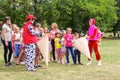 Children have fun and play with the animators in funny costumes