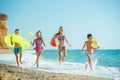 Children have fun on the sandy beach in summer. Royalty Free Stock Photo