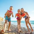 Children have fun on the sandy beach in summer. Royalty Free Stock Photo