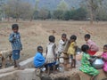 A Children have gathered in the hand pump for water