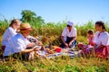 Children are having breakfast at traditional wheat harvest Royalty Free Stock Photo