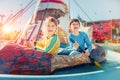 Children having fun at amusement park. Ride on canoe. Happy childhood concept Royalty Free Stock Photo
