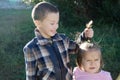 Children having fun. Boy and little girl portrait. Happy smiling children outdoors at sunny day. Friendship siblings Royalty Free Stock Photo