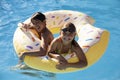 Children Having Fun With Inflatable In Outdoor Swimming Pool Royalty Free Stock Photo