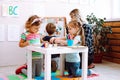 Children having fun and learning in kid development center or school. ABC, numbers reading and writing skills on courses Royalty Free Stock Photo