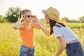 Children are having fun in nature, two girls laugh