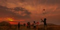 Children Having Fun Playing Kites in Sunset