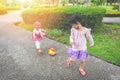 Children having fun playing outside Asian kids girl running happy with toys in the garden park - International ChildrenÃ¢â¬â¢s Day Royalty Free Stock Photo