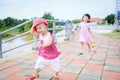 Children having fun playing outside Asian kids girl running happy with toys in the garden park - International ChildrenÃ¢â¬â¢s Day Royalty Free Stock Photo