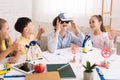 Children having fun with vr goggles in classroom