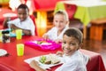 Children having lunch during break time in school cafeteria Royalty Free Stock Photo