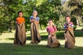 Children having a sack race in park Royalty Free Stock Photo