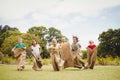 Children having a sack race in park