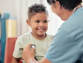 Children, healthcare and stethoscope with a doctor or pediatrician listening to the heartbeat of a boy patient in the Royalty Free Stock Photo