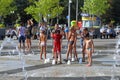 Children in the heat bathe in the fountain of Krasnodar Royalty Free Stock Photo