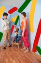 Children help parents to do repair room, collage Royalty Free Stock Photo