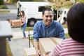 Children Helping Unload Boxes From Van On Family Moving In Day Royalty Free Stock Photo