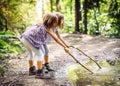 Children hiking in mountains or forest with sport hiking shoes. Royalty Free Stock Photo