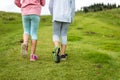 Children hiking in mountains or meadows with sport hiking shoes Royalty Free Stock Photo