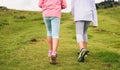 Children hiking in mountains or meadows with sport hiking shoes Royalty Free Stock Photo