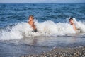 Children hit by wave Royalty Free Stock Photo