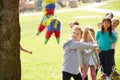 Children Hitting Pinata At Birthday Party Royalty Free Stock Photo