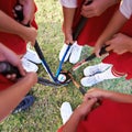 Children, hockey team and huddle above with ball on green grass for sports, match or game together. Top view closeup of Royalty Free Stock Photo