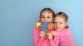 Children hold an autism symbol of support for special people with disabilities Royalty Free Stock Photo