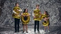 Children Hold Balloons In Form Of Numbers Two Thousand Twenty Three. One Boy Sprinkles Children With Sequins. New Year.