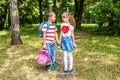 Children hold hands. The boy is carrying a backpack to a girl. T Royalty Free Stock Photo