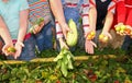 Children hold vegetables