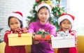 Children holding beautiful gift boxes and giving in Christmas celebration Royalty Free Stock Photo