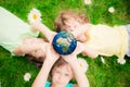 Children holding Earth planet in hands Royalty Free Stock Photo