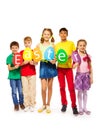 Children holding egg shape colourful cards in row Royalty Free Stock Photo