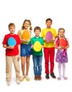 Children holding egg shape colourful cards Royalty Free Stock Photo