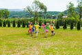 Children holding hands and dance in the circle Royalty Free Stock Photo