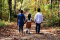 Children Holding Hands On A Path In The Woods