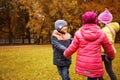 Children holding hands and playing in autumn park Royalty Free Stock Photo