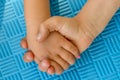 Children holding hands and playing together with unity and teamwork Royalty Free Stock Photo