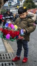 Children holding a lantern in the street