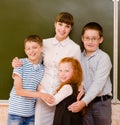 Children hugging their teacher