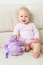 Children, infant and childhood concept - beautiful smiling baby sitting Royalty Free Stock Photo